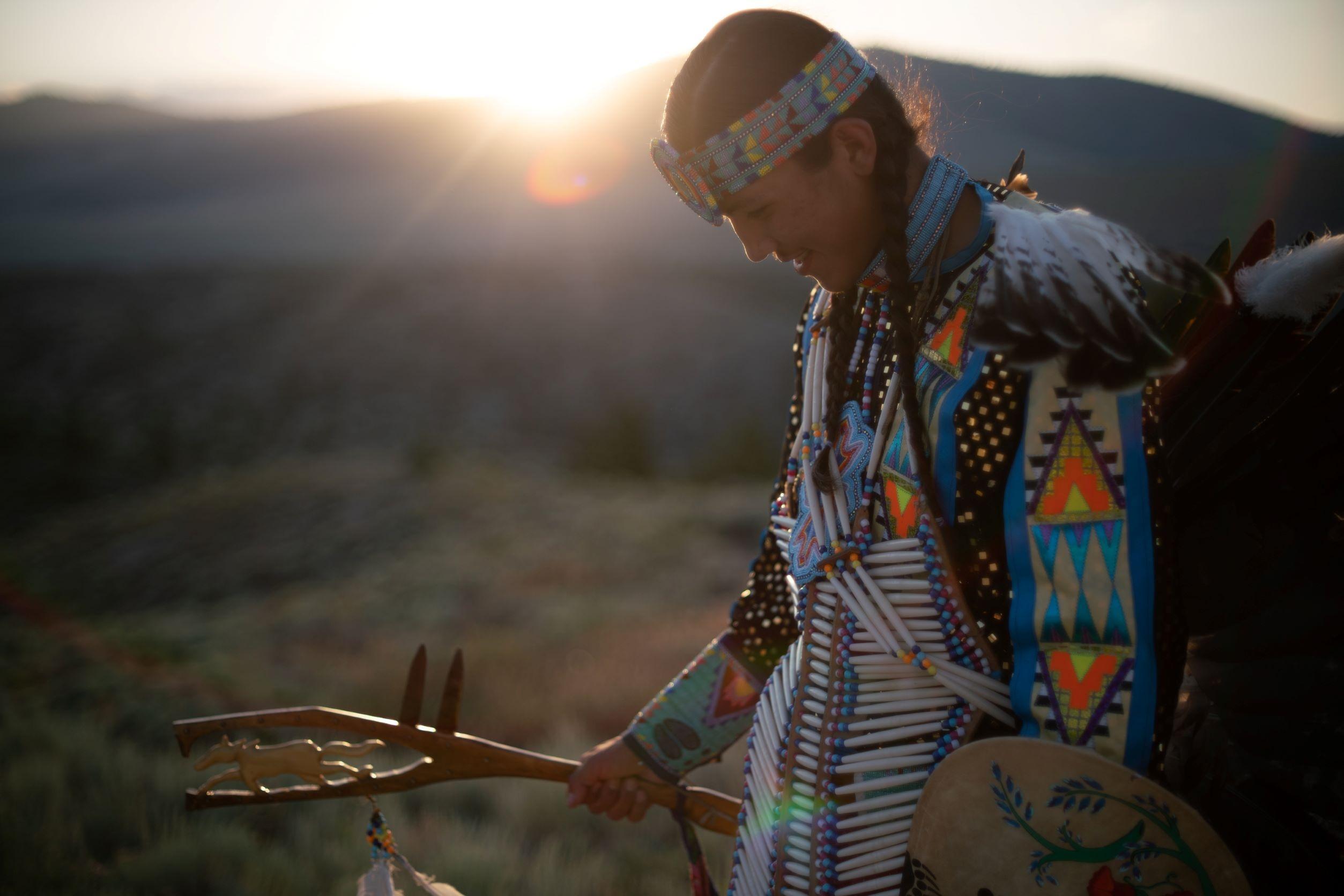 A traditional dancer on the Flathead Indian Reservation in colorful traditional dress.