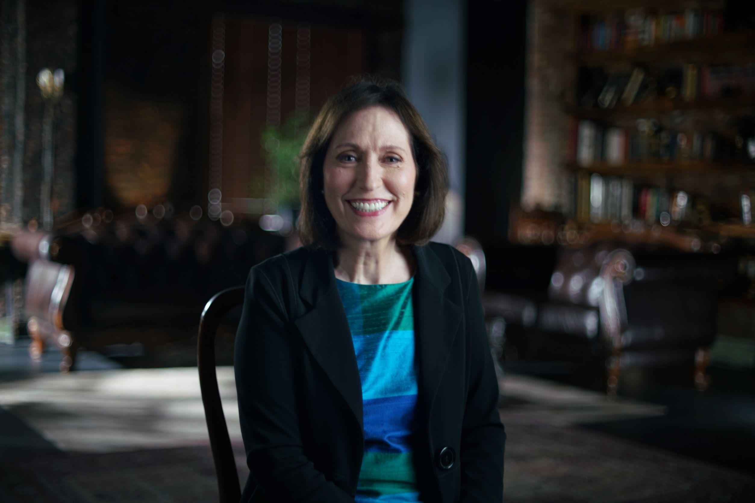 Dr. Madelyn Gould, PhD, MPH smiles at the camera