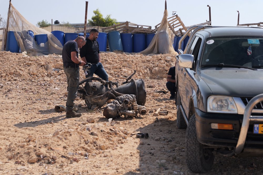 <bound method CaptionedImage.default_alt_text of <CaptionedImage: The remains of a rocket booster that, according to Israeli authorities critically injured a 7-year-old girl, after Iran launched drones and missiles towards Israel, near Arad>>